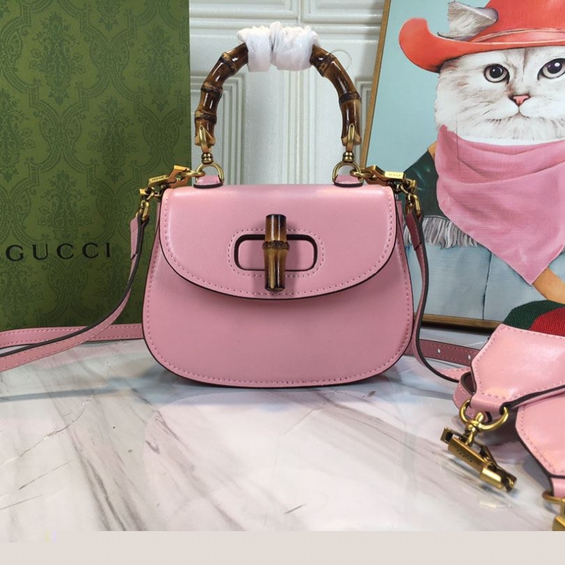 G*u*i top handle bags